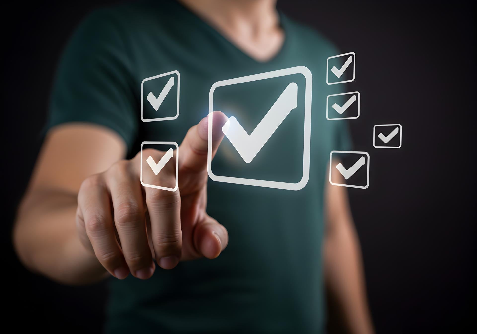 Man using a finger to select a check mark on a digital interface filled with check marks a concept of online survey digital assessment checklist and task completion The image is set against a dark bac