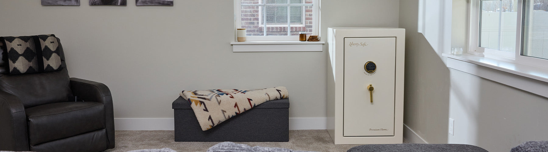 A small Premium Home safe is tucked into a corner in a livingroom