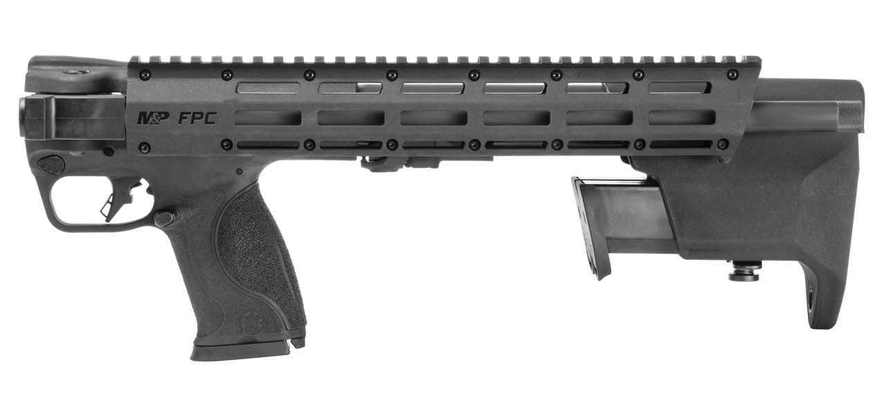 Black firearm with a rail system and ergonomic grip.