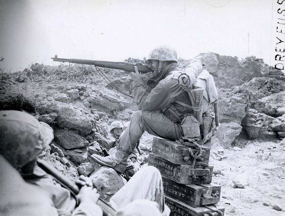 Soldier firing M1 Garand Rifle