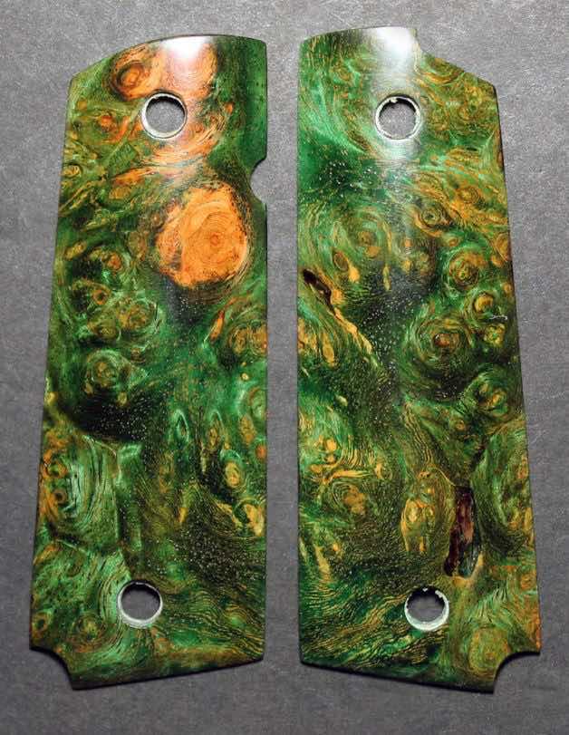 Two green and brown patterned wood grips for a knife.