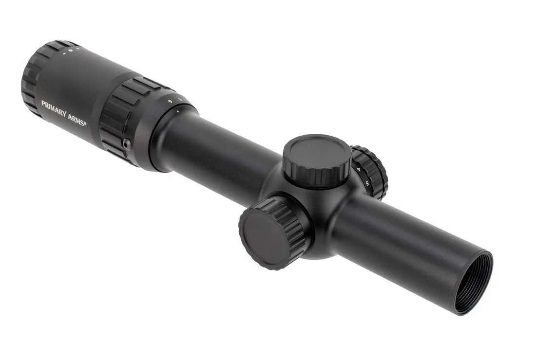 A black rifle scope with adjustment knobs and a cylindrical body.
