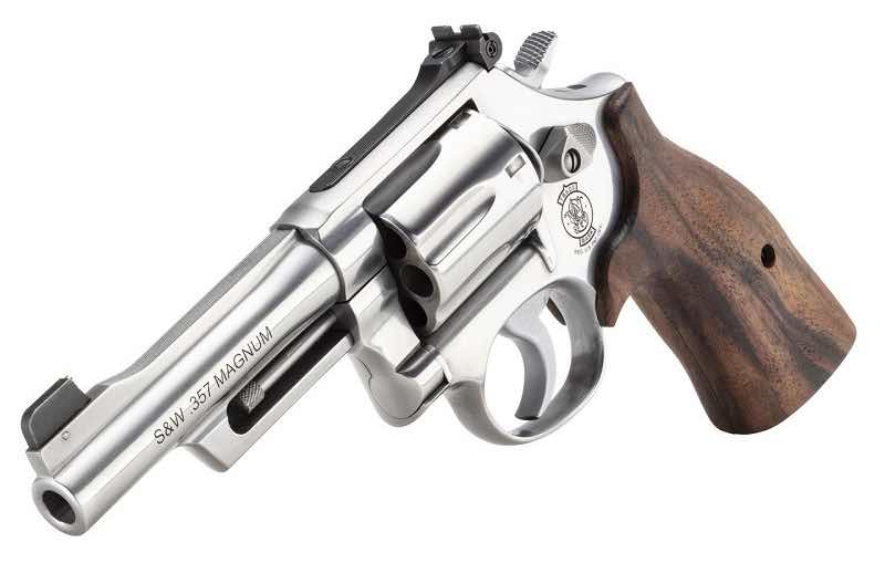 A silver revolver with a wooden grip on a white background.