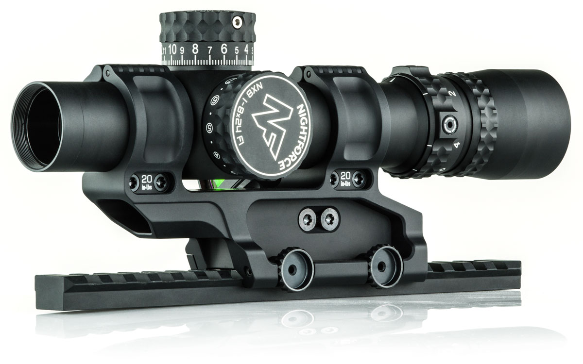 Black rifle scope with adjustment knobs and mounting base.