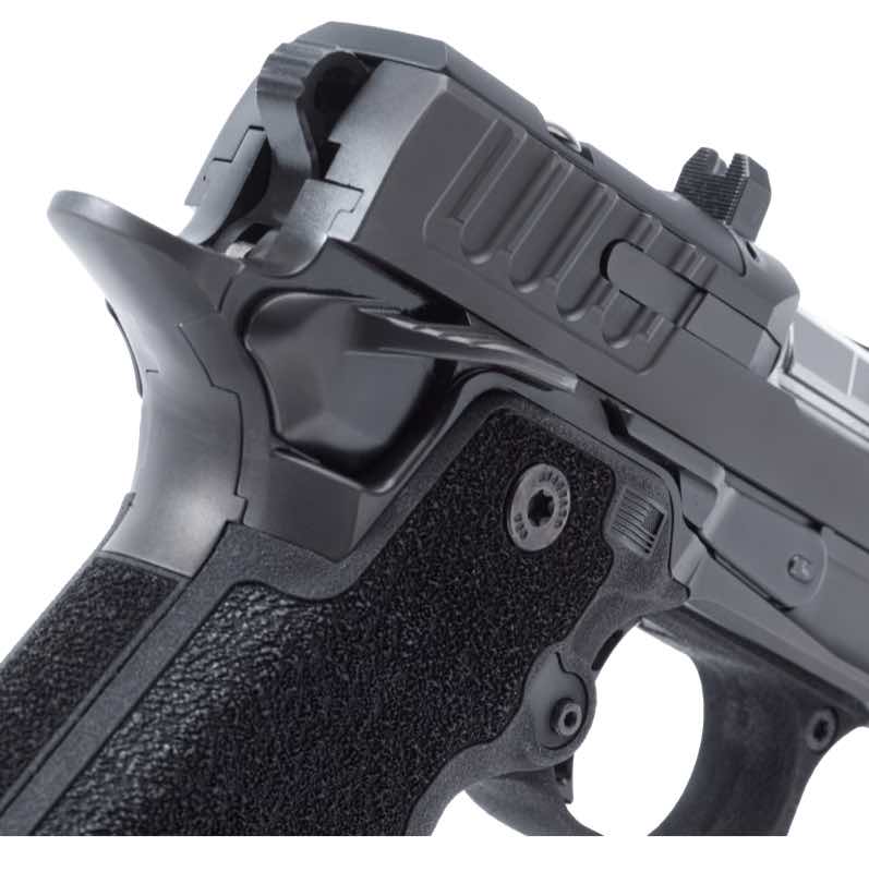 Close-up of a black handgun showing grip and slide mechanisms.