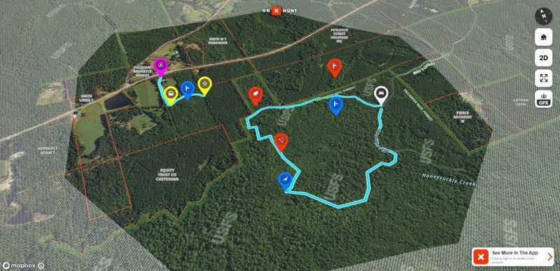 Map of a forested area with marked locations and a blue trail.