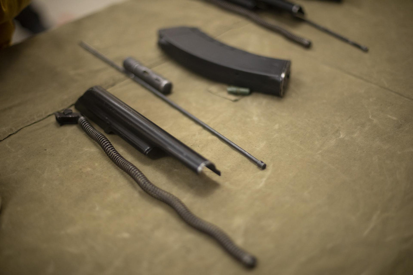 Disassembled machine. Military training. Weapon parts. Firearm.