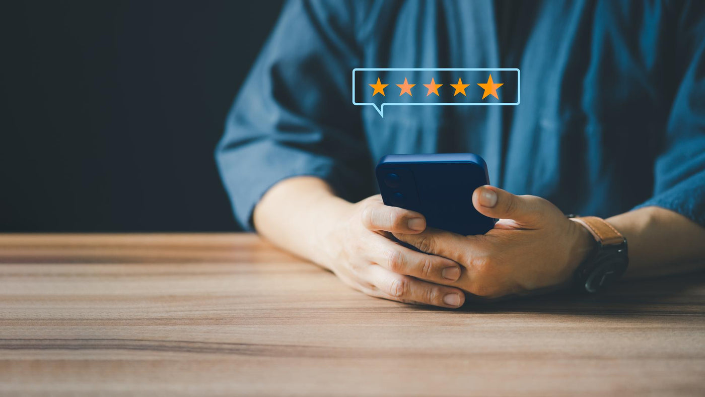Man using a smartphone in give rating to service experience on application. Online customer review satisfaction feedback survey.