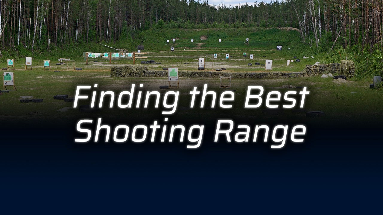 A shooting range surrounded by trees with targets visible.