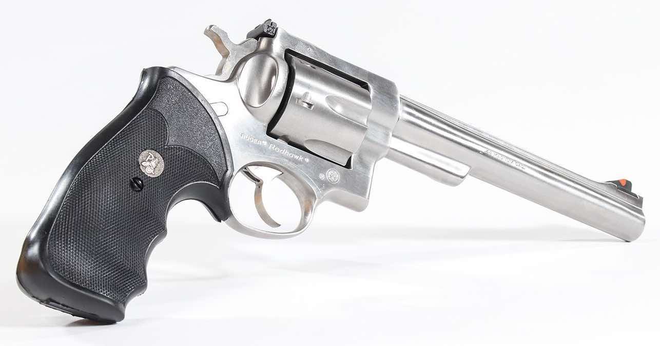 A silver revolver with a black grip on a white background.
