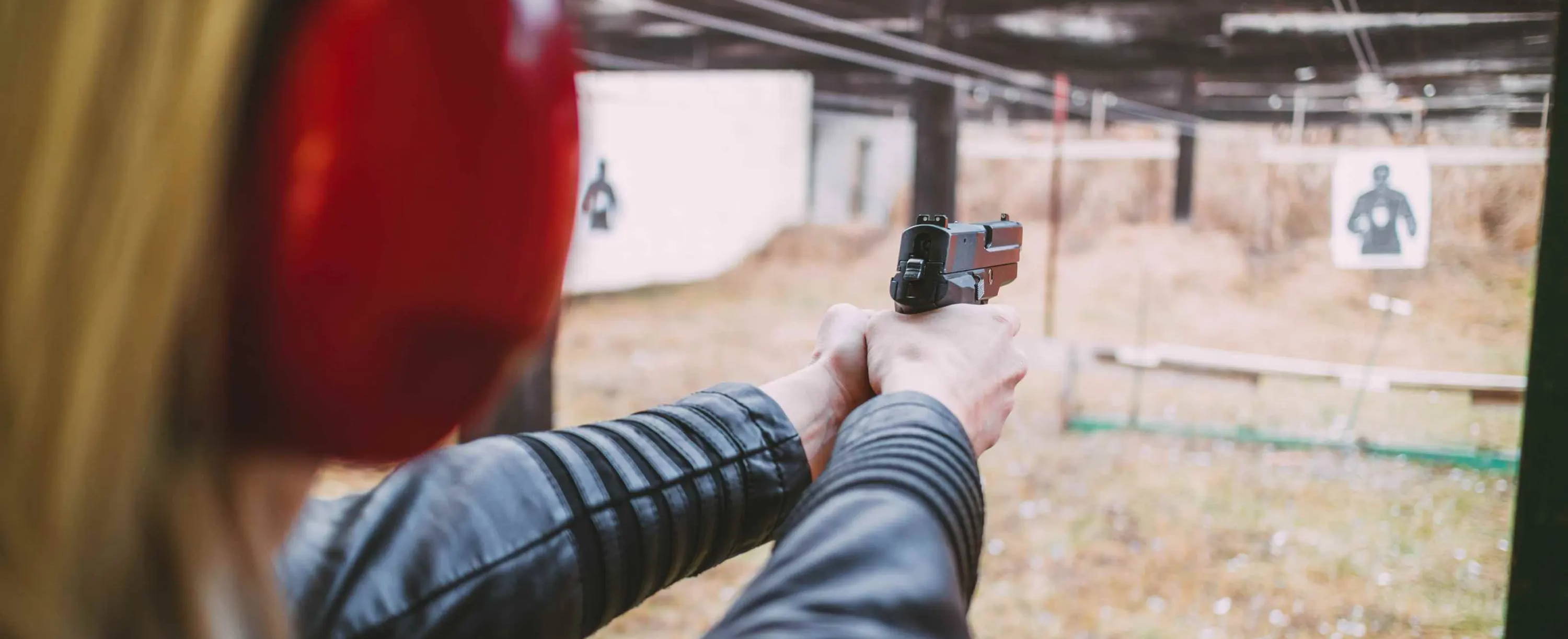 Woman shooting at gun range