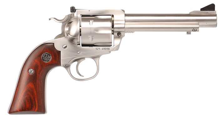A silver revolver with a wooden grip on a white background.