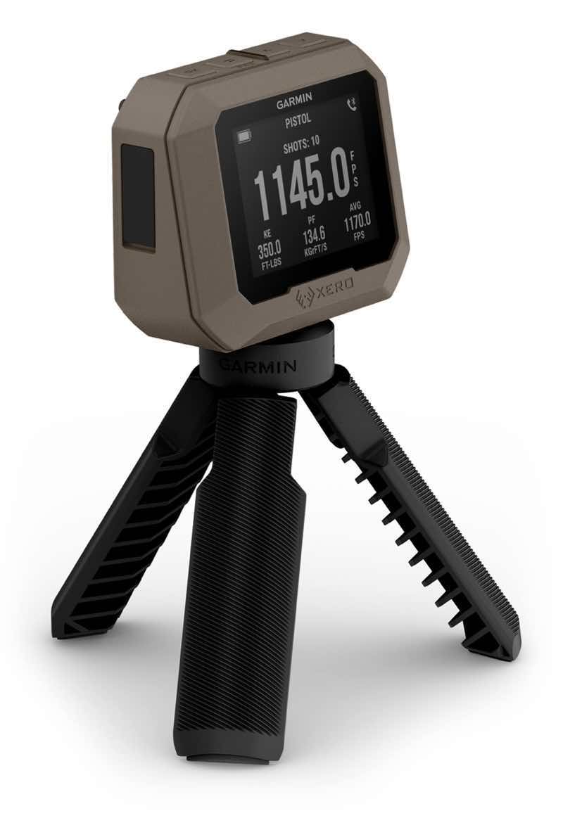 A digital device on a tripod displaying a measurement readout.