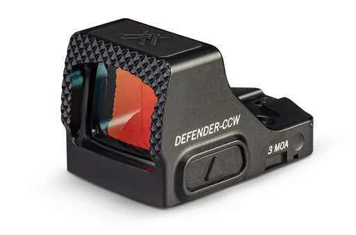 Red dot sight with a textured body and illuminated reticle.