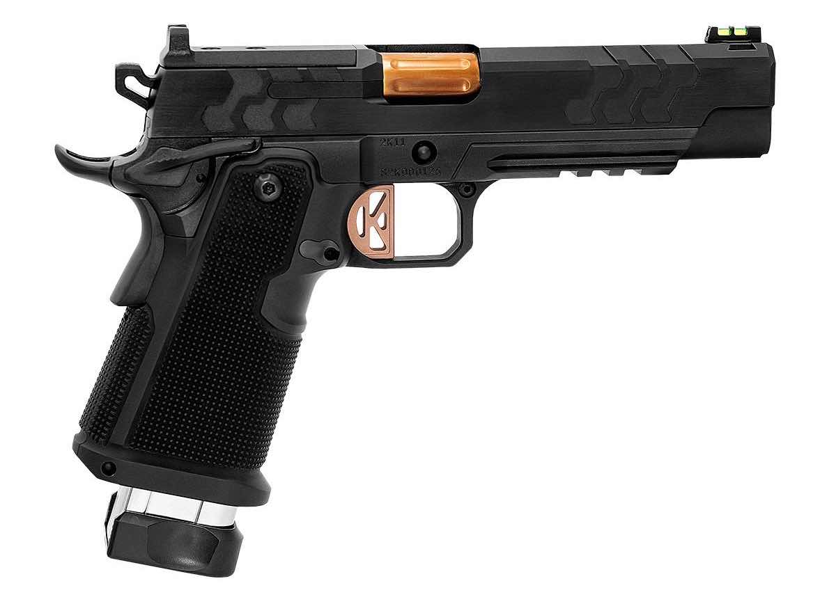 Black semi-automatic pistol with an orange accent and extended magazine.