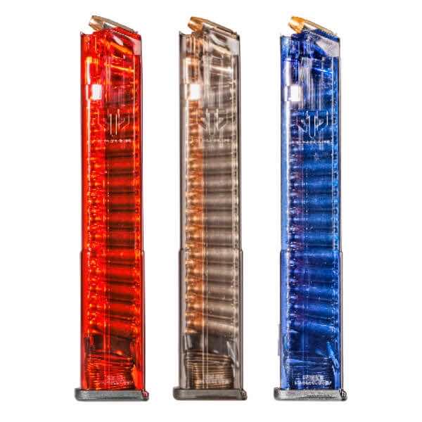 Three transparent magazine clips in red, clear, and blue colors.